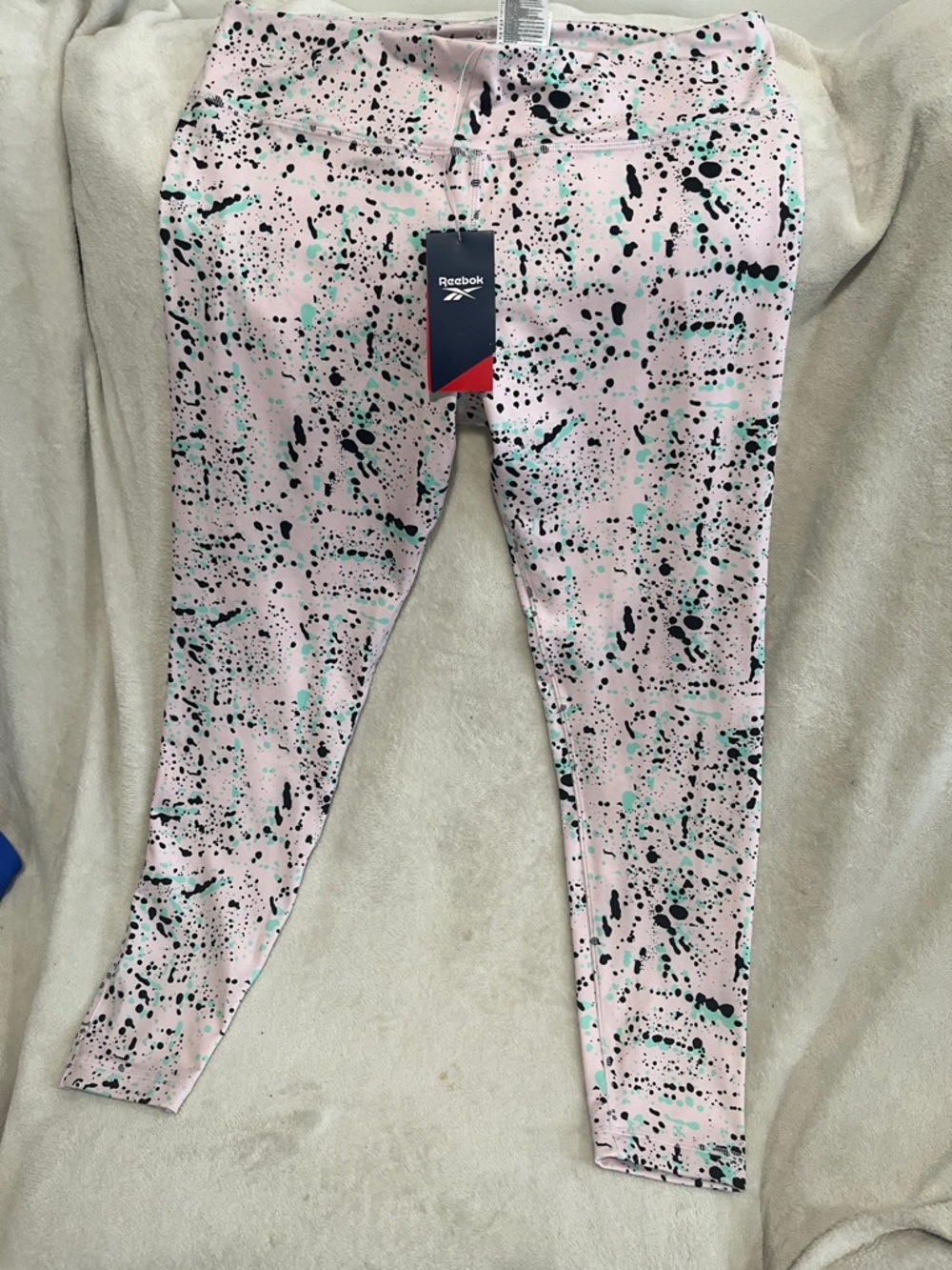 Reebok women’s Pink, Black & Mint Splatter Leggings